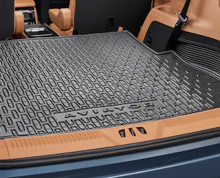 Closeup shot of cargo area protector with Aviator® logo in a trunk