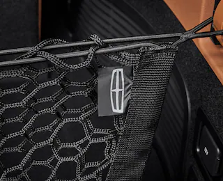Closeup shot of a cargo net with a Lincoln® logo