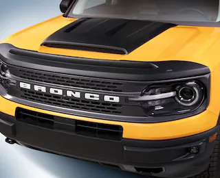Close-up of a Bronco Sport® SUV front grille with bug deflector and hood scoop