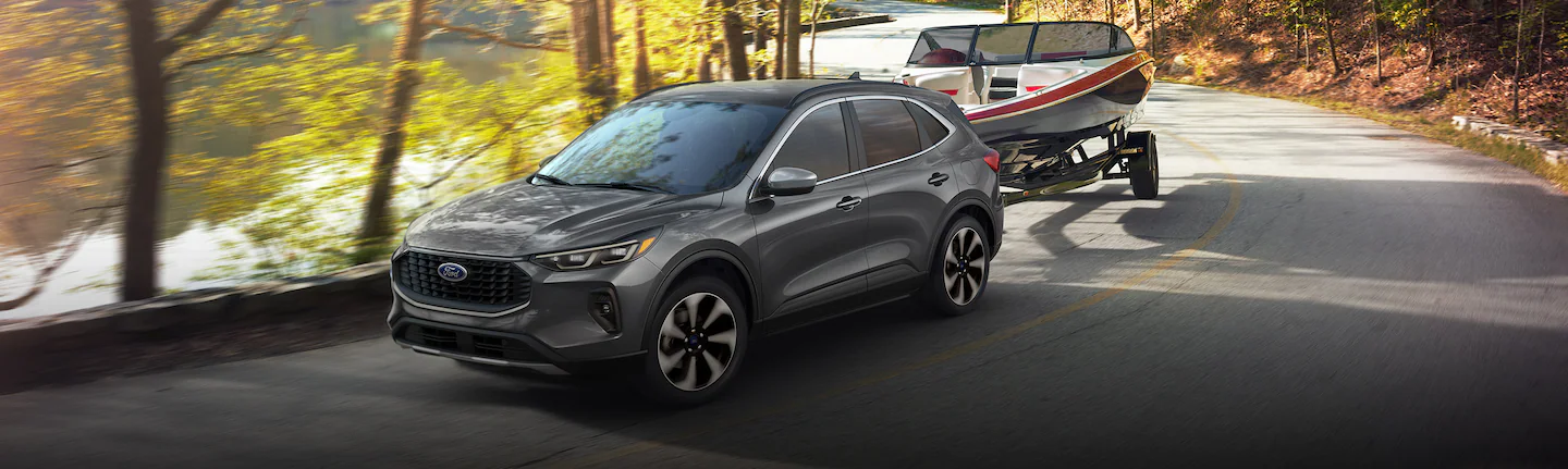 A 2025 Ford Escape® towing a boat