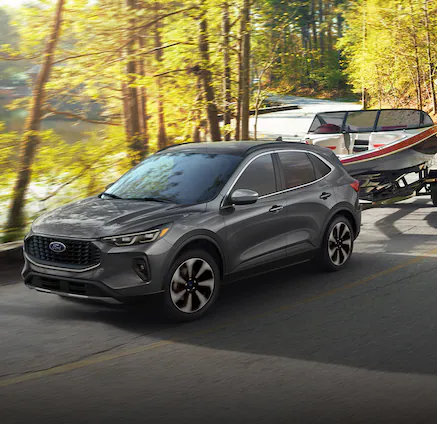 A 2025 Ford Escape® towing a boat