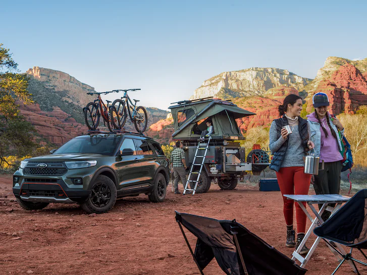 A 2024 Explorer® Timberline® with people camping in a canyon