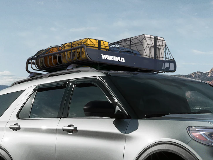 Closeup of a 2025 Ford Explorer® with the Yakima roof rack and various items on it
