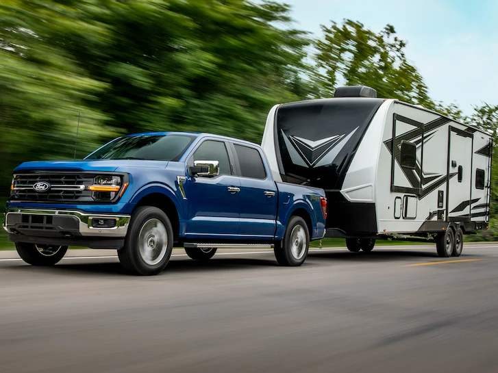 A 2025 Ford Truck F-150® towing a camper