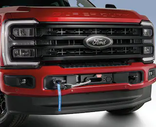 Closeup of a Ford Super Duty® grille showing Warn Winch