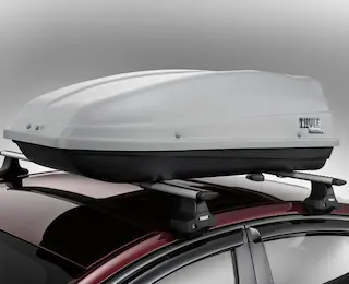 Closeup of a Thule roof top carrier mounted on a 2025 Ford Fusion