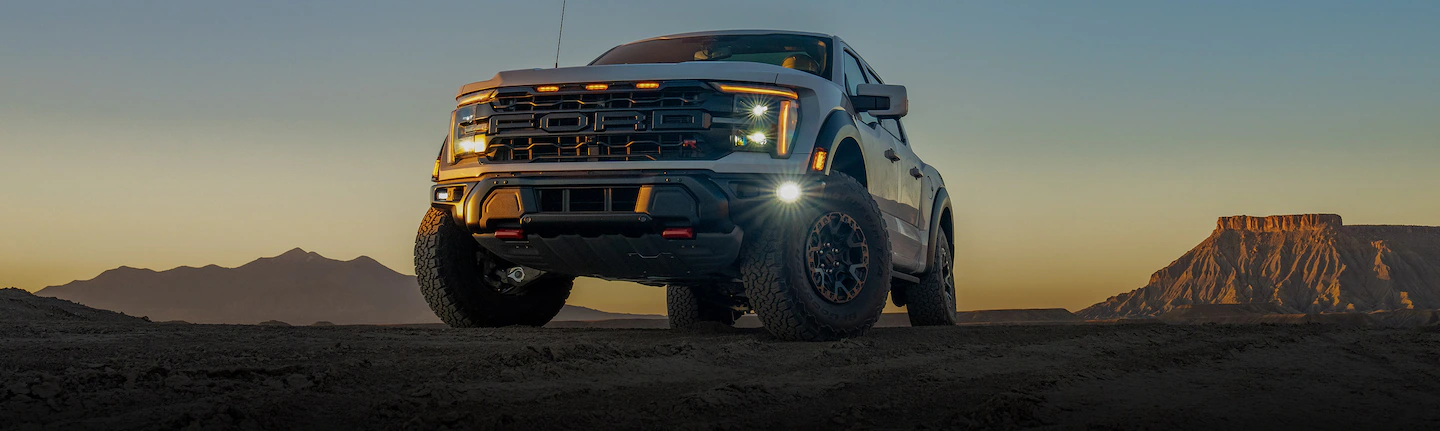 An 2025 Oxford White F-150® parked at sunset in desert