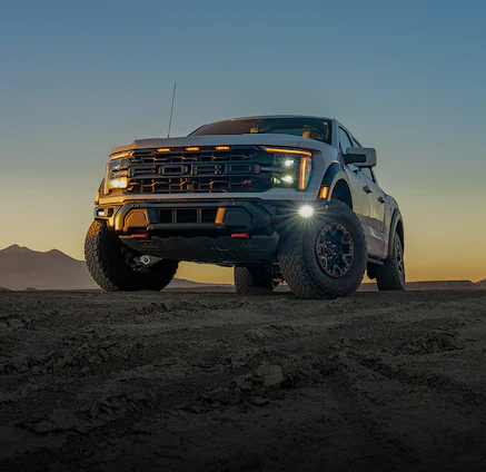 An 2025 Oxford White F-150® parked at sunset in desert
