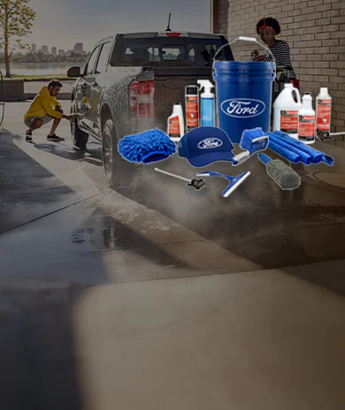 Ford Total Care Cleaning Kit displayed with Maverick® pickup being washed in the background