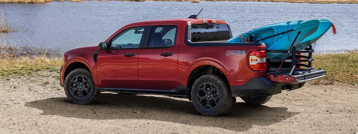 A 2025 Ford Maverick® Lariat with kayaks loaded in the bed