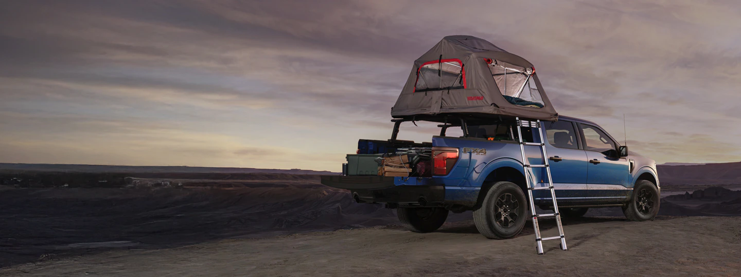 Ford® F-150® pickup parked with Yakima Roof Top Tent open above truck bed