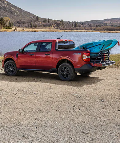A 2025 Ford Maverick® Lariat with kayaks loaded in the bed