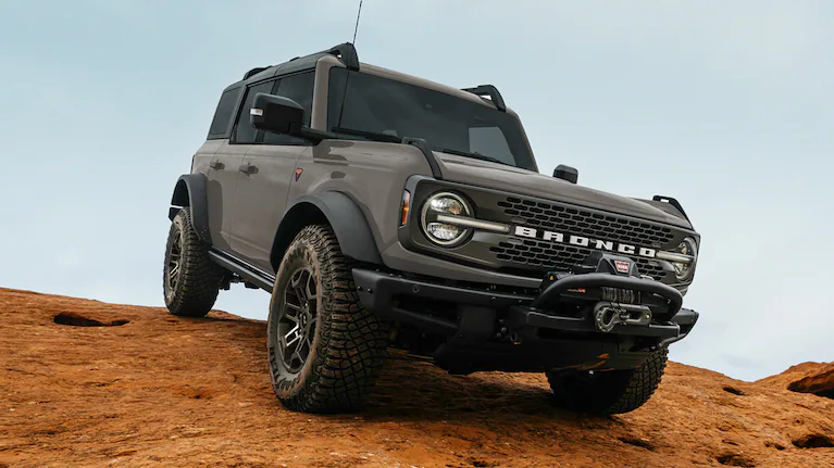 A 2026 Ford Bronco® SUV being driven down a dirt hillside