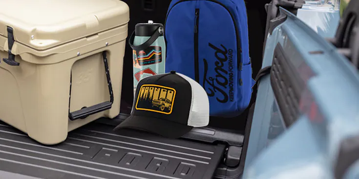 Close-up of Ford merchandise including a backpack, and hat