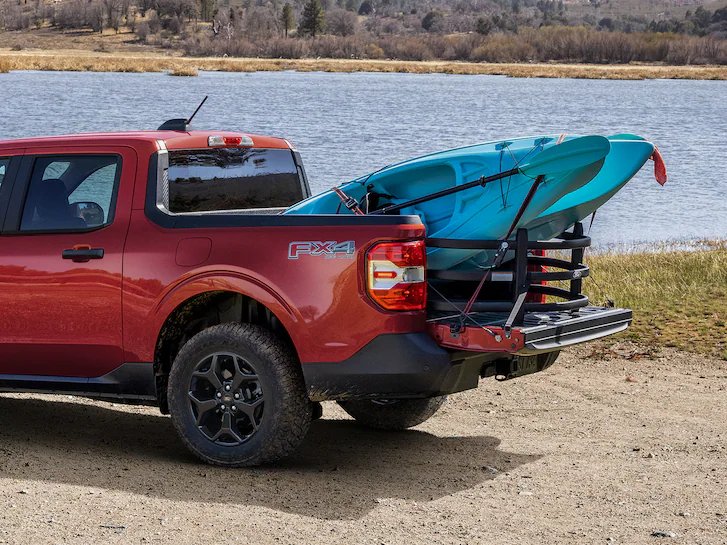 A 2025 Ford Maverick® Lariat with kayaks loaded in the bed
