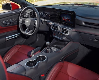 Interior of a 2025 Mustang® dashboard, center console, and seats