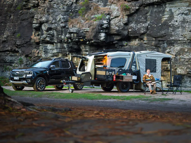 A 2025 Ford Ranger® parked next to a full camping set up